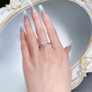 Macro view of emerald-cut radiant cubic zirconia ring with micro-pave sterling silver band