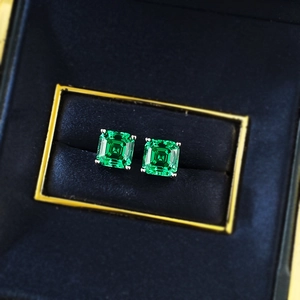 Elegant 7x7mm Asscher cut emerald green earrings set in silver four-prong studs
