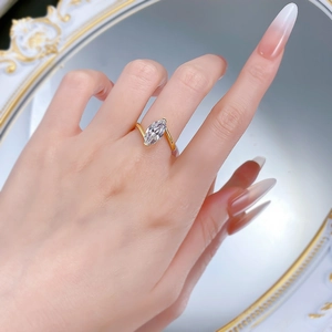 Elegant 925 silver ring with golden finish and marquise cut marquise diamond on model