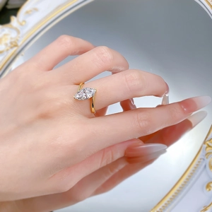 Close-up of a marquise-cut crystal ring in 18K gold plating worn on a model hand