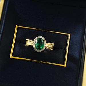 S925 silver ring with oval emerald gemstone and halo diamonds in vintage gold finish
