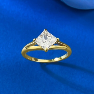 Detailed top view of a gold princess cut square diamond ring with a split shank band