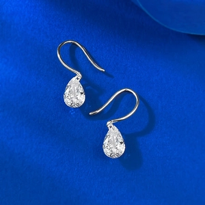 Elegant pair of 925 silver pear-cut teardrop cubic zirconia drop earrings on dark blue base