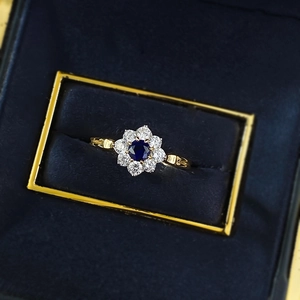 Elegant S925 silver ring featuring a 4mm blue sunflower sapphire design in a velvet box