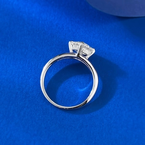 Side view of silver S925 ring featuring a princess cut white stone in a four-prong setting