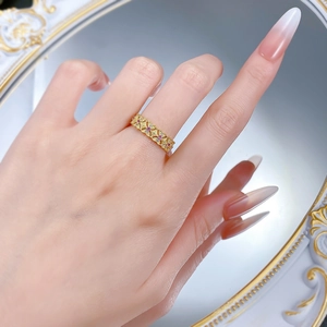 Detail of S925 silver lace ring with gold finish and purple gemstones on baroque mirror