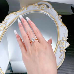 Detailed close-up of a gold-plated S925 silver ring with a large radiant cut cubic zirconia