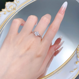Detail view of princess cut cubic zirconia ring with split shank and four-prong setting