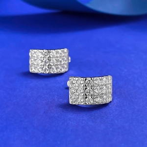Close-up of S925 silver stud earrings with three rows of pavé set white diamonds