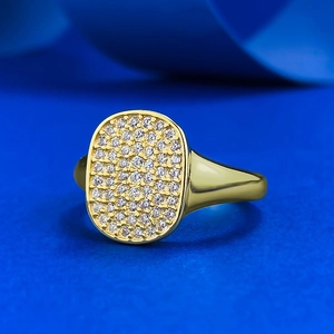 S925 silver 18K gold plated ring with oval pave zircon on dark blue silk background