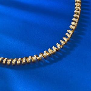 Luxurious S925 silver spiral bracelet with full diamonds on a blue silk background