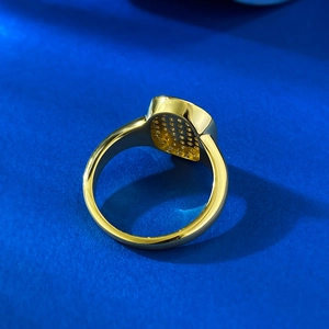 Macro shot of 18K gold plated S925 silver ring featuring intricate honeycomb cutout detail