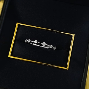 Detailed close-up of S925 sterling silver ring with sparkling round zirconia stones