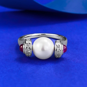 S925 silver vintage pearl ring with red gemstones and micro-pave accents on blue backdrop