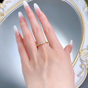 Detailed view of S925 silver ring featuring three square-cut stones on a hand