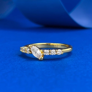 Macro detail of gold-plated S925 silver ring with marquise-cut stone and S925 hallmark