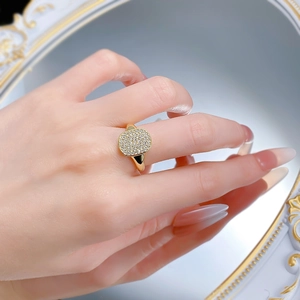 Macro shot of 18K gold plated silver ring with micro-paved cubic zirconia gems