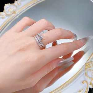 Detailed view of S925 sterling silver three-piece ring set with zircon on hand