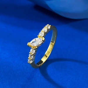 S925 sterling silver ring with marquise cut zircon on a blue textured background
