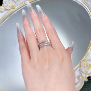 Detailed view of S925 silver multi-layer coiled ring with zircons on finger