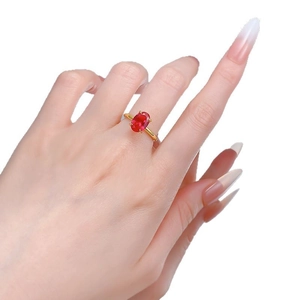 S925 sterling silver gold plated ring with oval pigeon blood red carbon diamond on finger