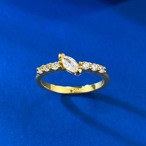 Gold S925 silver ring with marquise-cut zircon center stone on blue background