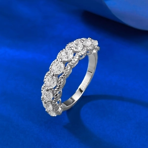 Macro shot of S925 sterling silver band ring with seven round white cubic zirconia stones