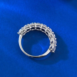 Elegant S925 sterling silver hollow eternity ring with sparkling white zircons on blue base