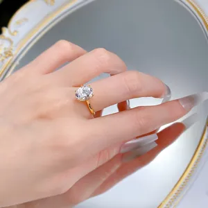 Close-up of a 8x10mm oval-cut gem ring with four-prong setting on a gold band