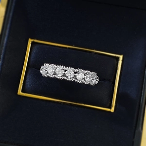 S925 sterling silver hollow row ring with 6 round white diamonds in a navy velvet box