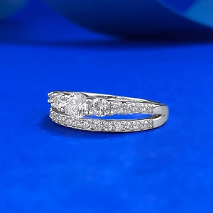 S925 sterling silver double-row ring with round white zircon stones on blue background
