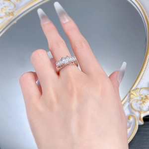 Detail of S925 silver plated ring featuring square princess cut stone and side diamonds