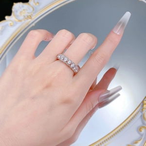 Close-up of S925 silver hollow eternity ring with sparkling round white zircons on hand