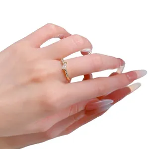 Elegant gold ring with marquise cut zircon and micro pave diamonds on a slim band