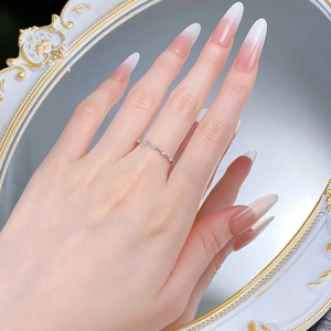 Detail showing an elegant thin S925 silver band set with tiny round sparkling diamonds