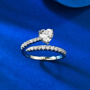 Detailed shot of S925 sterling silver ring with heart-cut stone and micro-pave diamonds