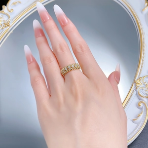 Detail of gold-plated S925 silver ring featuring bubble band and sparkling row of zircons