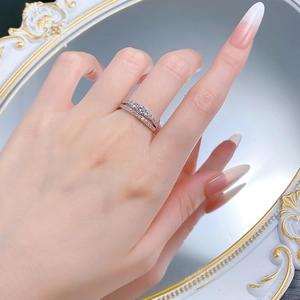 Macro detail of a S925 sterling silver double-layer ring with round-cut sparkling diamonds