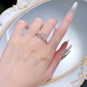 Detail of S925 silver wrap ring featuring heart-shaped stone and micro-paved band