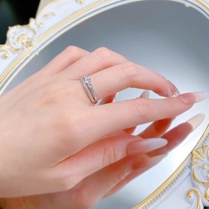 Detail of elegant S925 silver double-row ring with shimmering cubic zirconia on hand