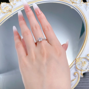 Detailed view of S925 silver princess cut ring with shimmering side accent stones