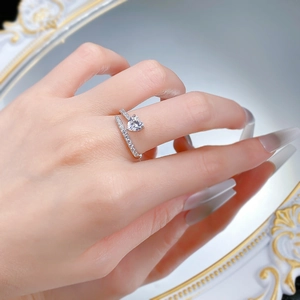 Detailed view of an S925 silver heart-shaped gemstone ring on a model's finger