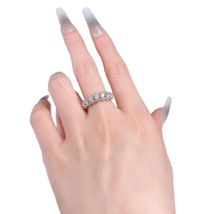 Classic S925 sterling silver half-eternity ring with white zircon stones on a female hand