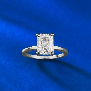Macro view of a 6x8mm rectangle ice cut silver ring with classic four-prong setting