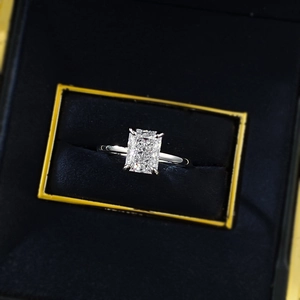 Detailed view of rectangular ice cut silver ring in a black jewelry box display