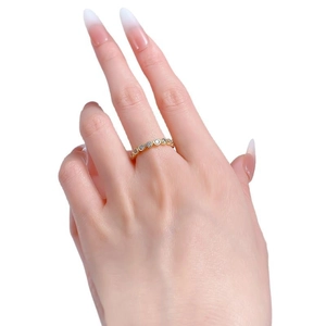 Eternity ring in gold finish with sparkling pavé cubic zirconia on model finger