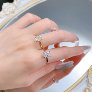 Detail of 925 silver rings with square ice cut cubic zirconia in gold and silver