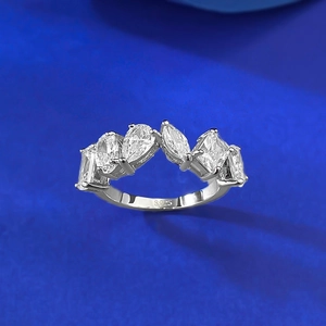 Elegant S925 sterling silver ring with mixed-cut cubic zirconia on a blue background