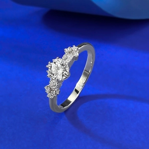 Elegant S925 sterling silver round solitaire ring with side accents on blue velvet