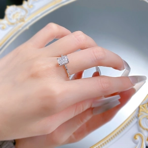 Detailed side view of 6x8mm ice cut clear cz ring with pave set stones on hand